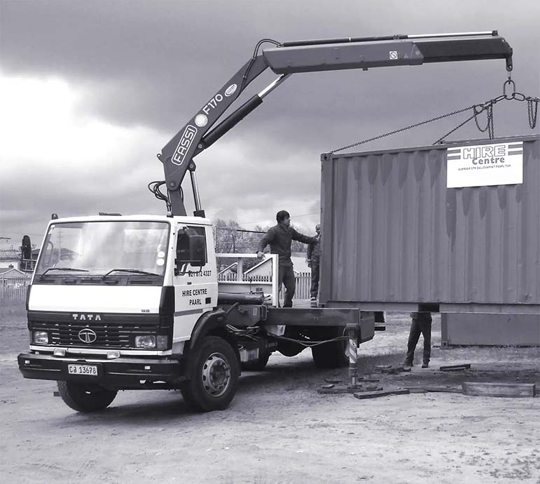 Delivery of a container with a crain lorry in a residential area in paarl